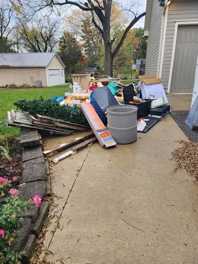 Dumpster being loaded with debris for Roofing Dumpster Rental in Obetz